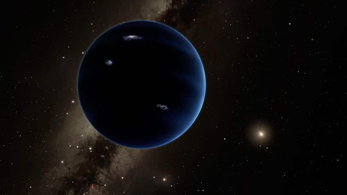 a hidden ice giant at the edge of the solar system new simulations reignite the cosmic mystery